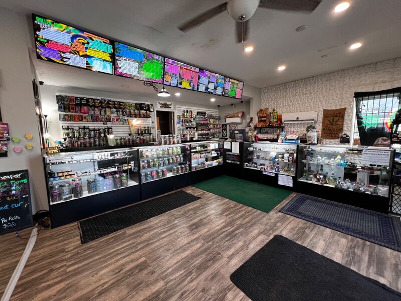Treehouse Pharmacy dispensary interior with display cases and menu boards
